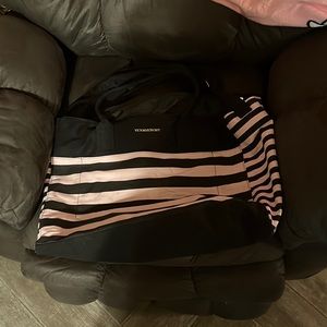 Victoria Secret large pink and black tote bag in used condition.  (See pictures)